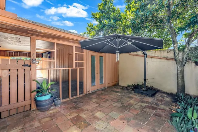 a view of a backyard with potted plants