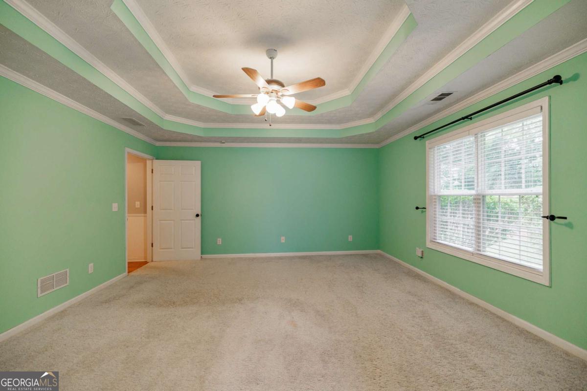 2249 Cluster Lane Grayson, GA 30017 - Photo 18 of 53 a view of an empty room with a window