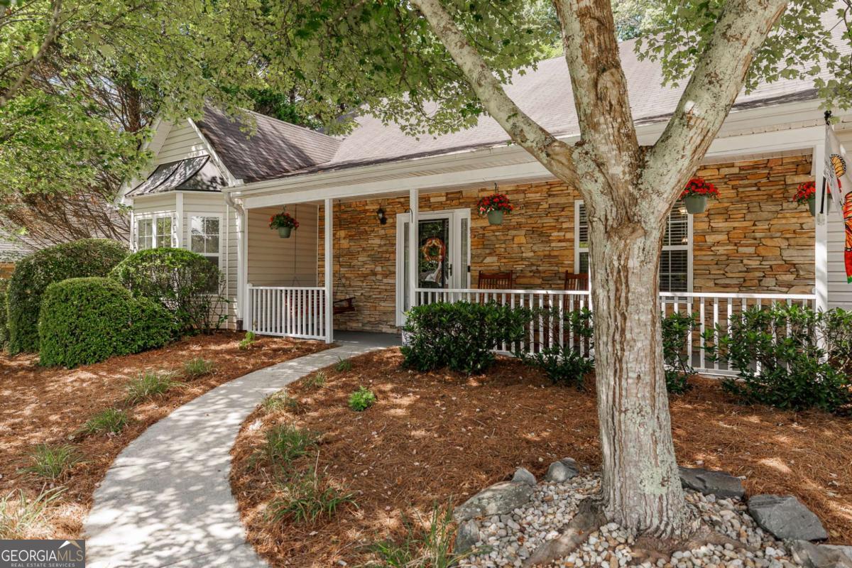 2249 Cluster Lane Grayson, GA 30017 - Photo 2 of 53 a view of a house with a large tree and wooden fence