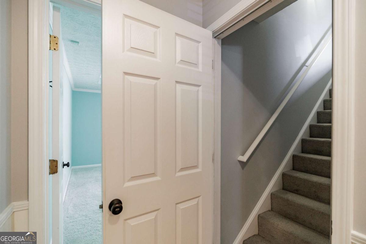 2249 Cluster Lane Grayson, GA 30017 - Photo 28 of 53 a view of staircase with white walls and white door