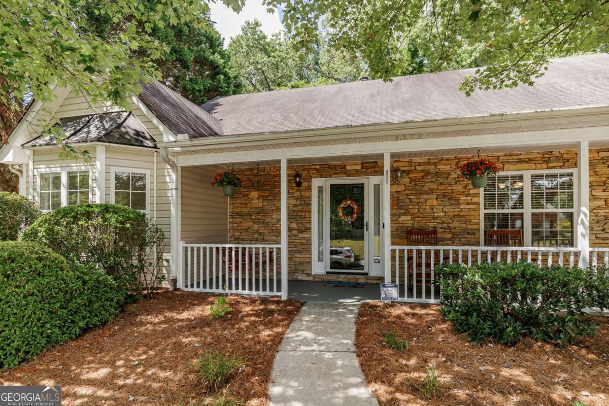 2249 Cluster Lane Grayson, GA 30017 - Photo 3 of 53 a front view of a house with a garden