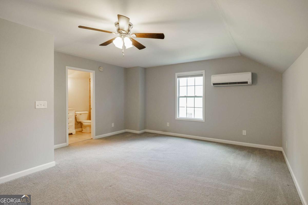 2249 Cluster Lane Grayson, GA 30017 - Photo 31 of 53 an empty room with windows and fan