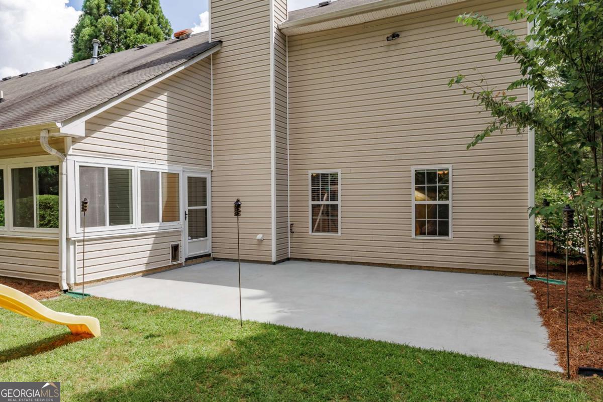 2249 Cluster Lane Grayson, GA 30017 - Photo 35 of 53 a view of a house with a yard and sitting area