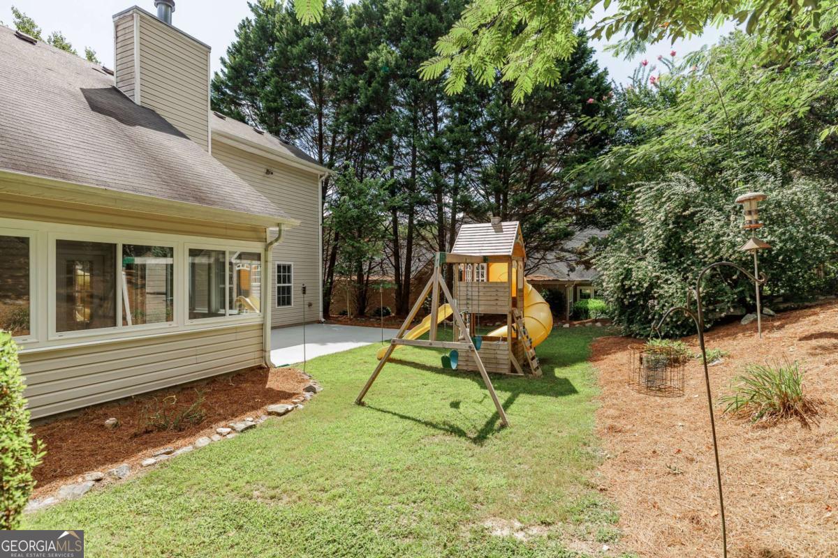 2249 Cluster Lane Grayson, GA 30017 - Photo 37 of 53 a view of a house with backyard and sitting area
