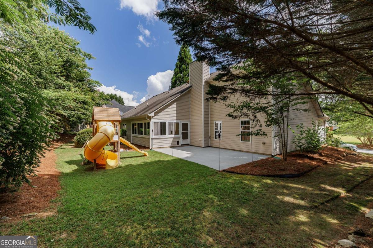 2249 Cluster Lane Grayson, GA 30017 - Photo 39 of 53 a view of a house with backyard and sitting area