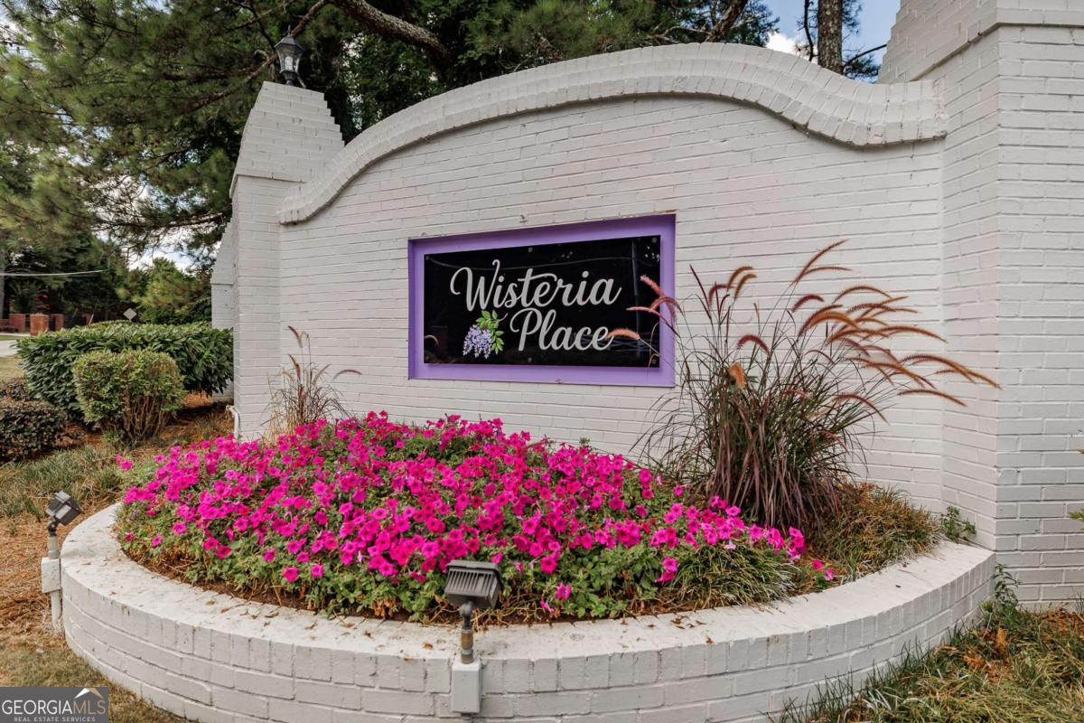 2249 Cluster Lane Grayson, GA 30017 - Photo 43 of 53 a view of a house with a flower garden