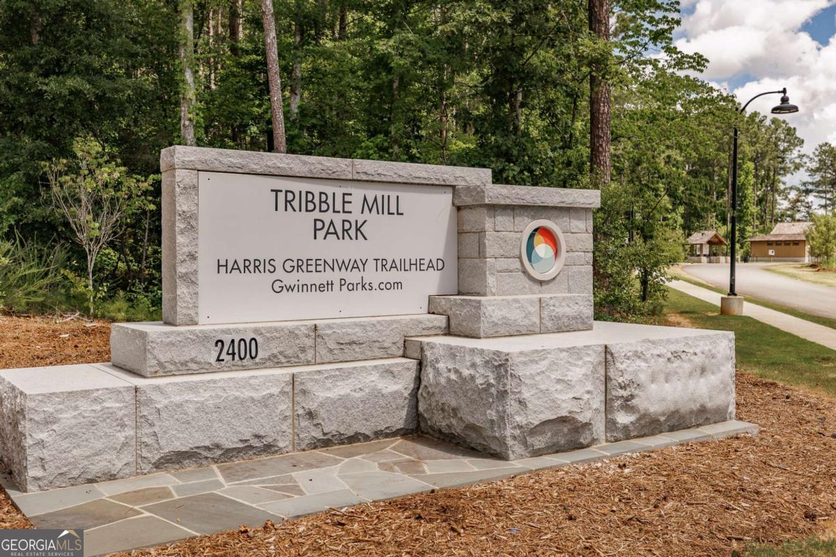 2249 Cluster Lane Grayson, GA 30017 - Photo 46 of 53 a view of a sign board with tree in the background