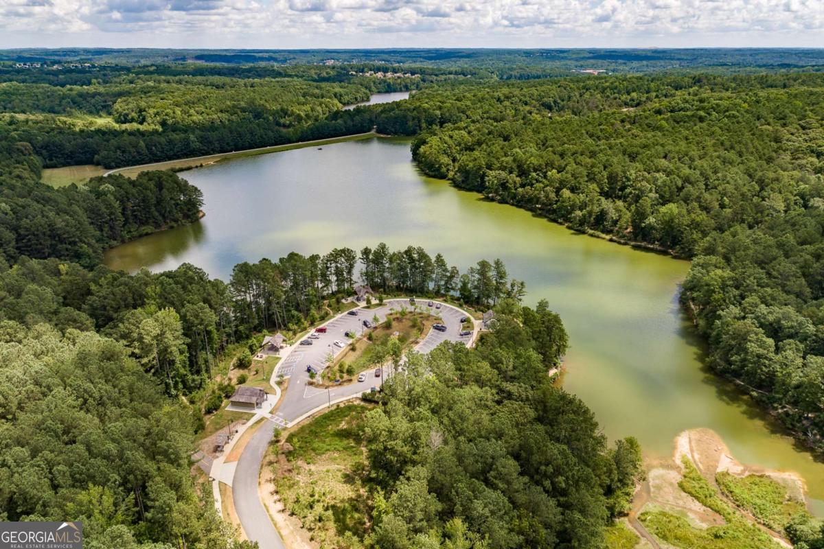 2249 Cluster Lane Grayson, GA 30017 - Photo 47 of 53 a view of a lake with a mountain in the back