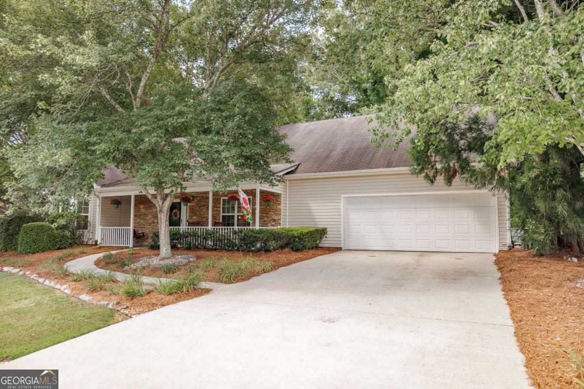 2249 Cluster Lane Grayson, GA 30017 - Photo 50 of 53 a front view of a house with garden
