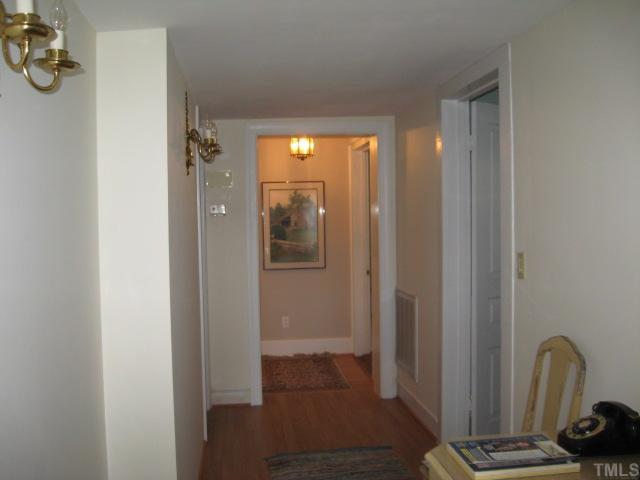 123700 School House Road Middlesex, NC 27557 - Photo 7 of 12 Hallway leading to other bedrooms and the Kitchen.