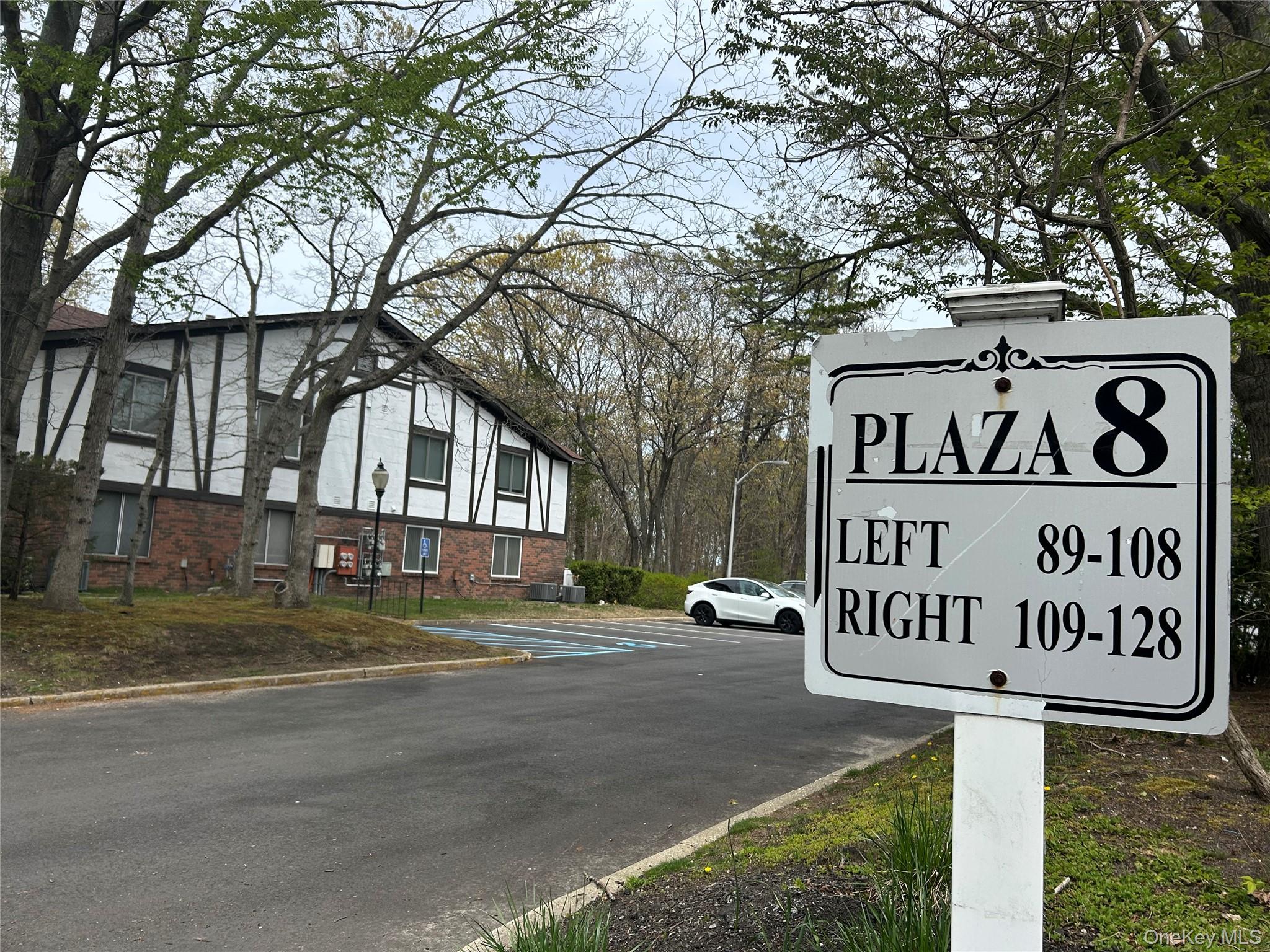 103 Birchwood Road, Unit 103 Medford, NY 11763 - Photo 13 of 13 a sign on a pole on a street