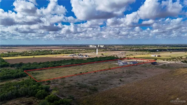 a view of a backyard with sitting area