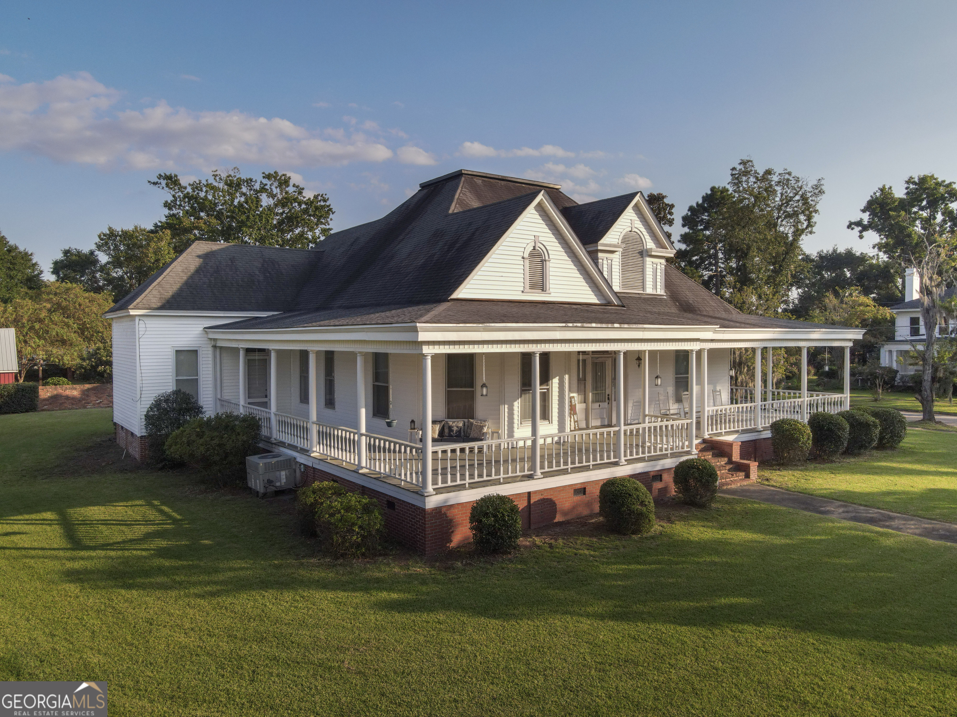 802 Mulberry Street Louisville, GA 30434 - Photo 1 of 51 a front view of a house with a garden