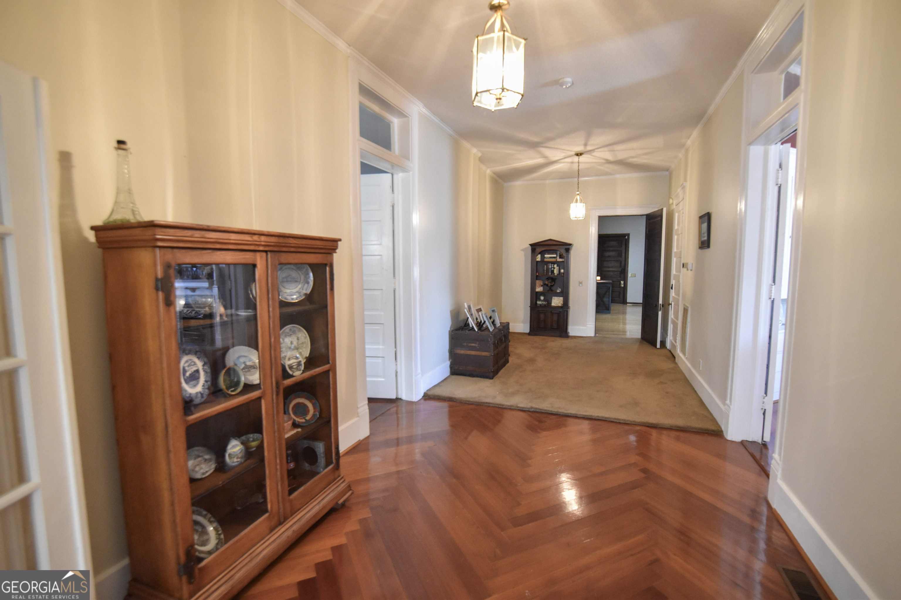 802 Mulberry Street Louisville, GA 30434 - Photo 12 of 51 a view of a hallway with wooden floor and workspace