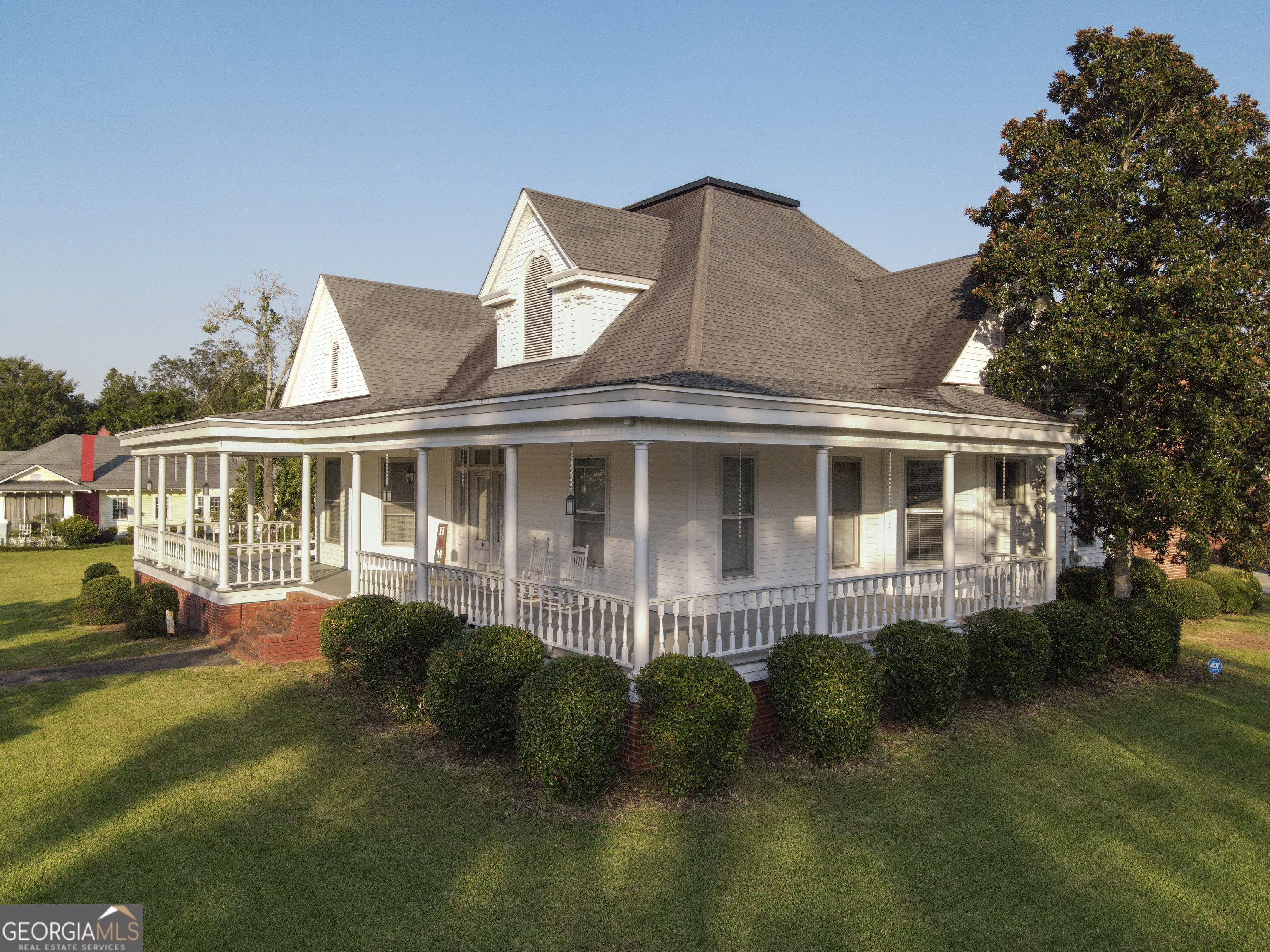802 Mulberry Street Louisville, GA 30434 - Photo 2 of 51 a front view of a house with a garden