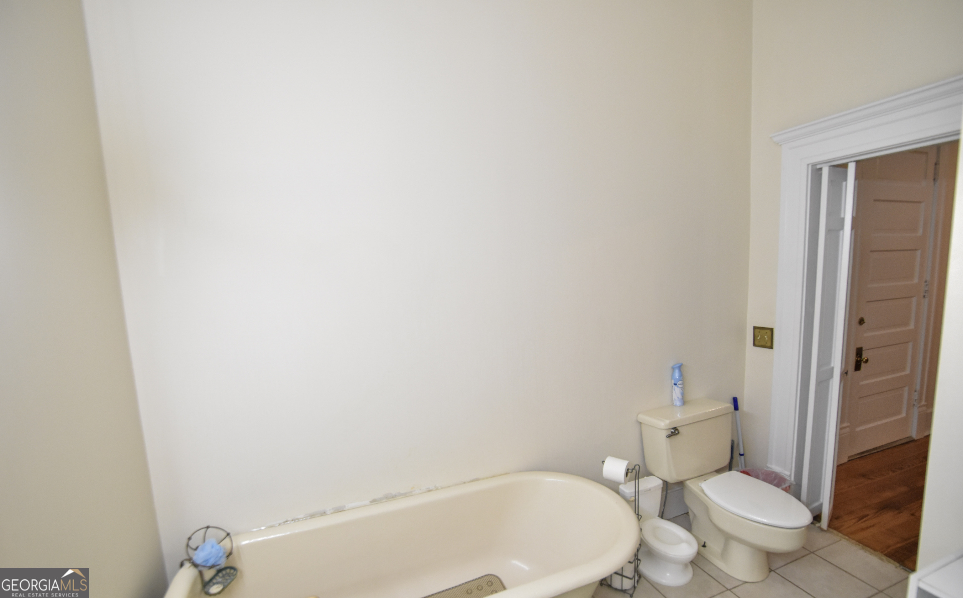 802 Mulberry Street Louisville, GA 30434 - Photo 32 of 51 a white toilet sitting next to a bathroom sink