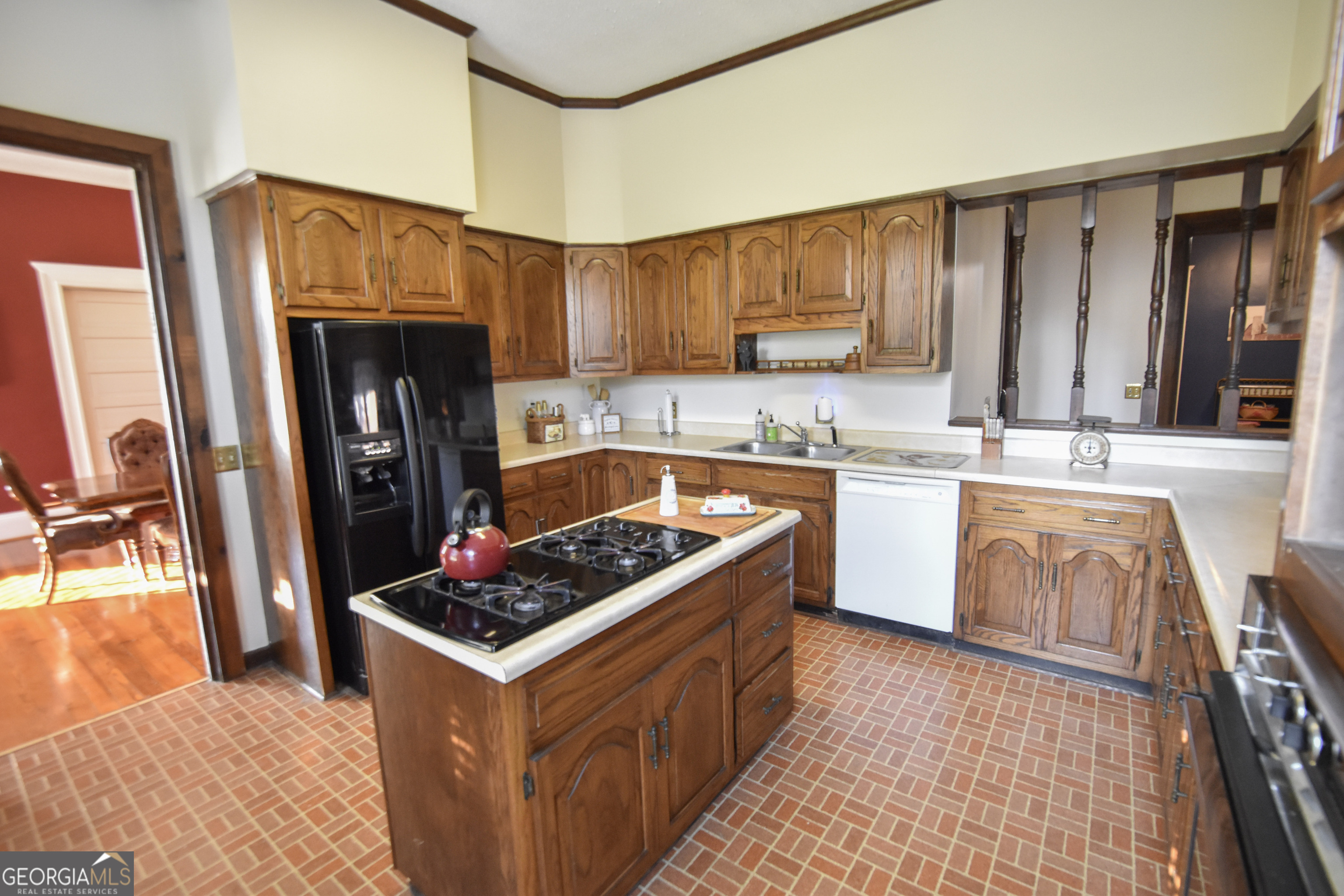 802 Mulberry Street Louisville, GA 30434 - Photo 38 of 51 a kitchen with stainless steel appliances granite countertop a stove a sink dishwasher and a refrigerator