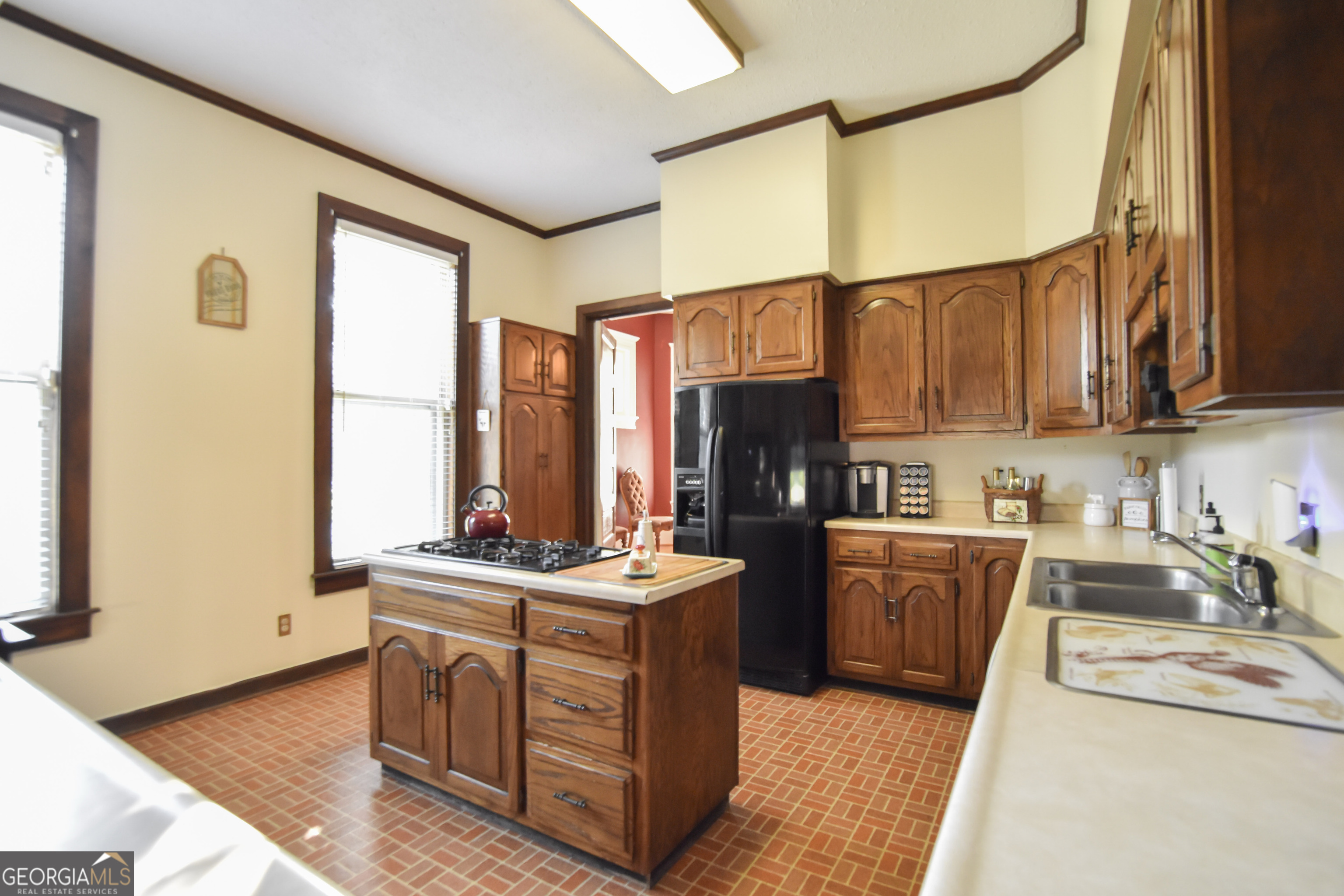 802 Mulberry Street Louisville, GA 30434 - Photo 40 of 51 a kitchen with stainless steel appliances granite countertop a sink stove and refrigerator