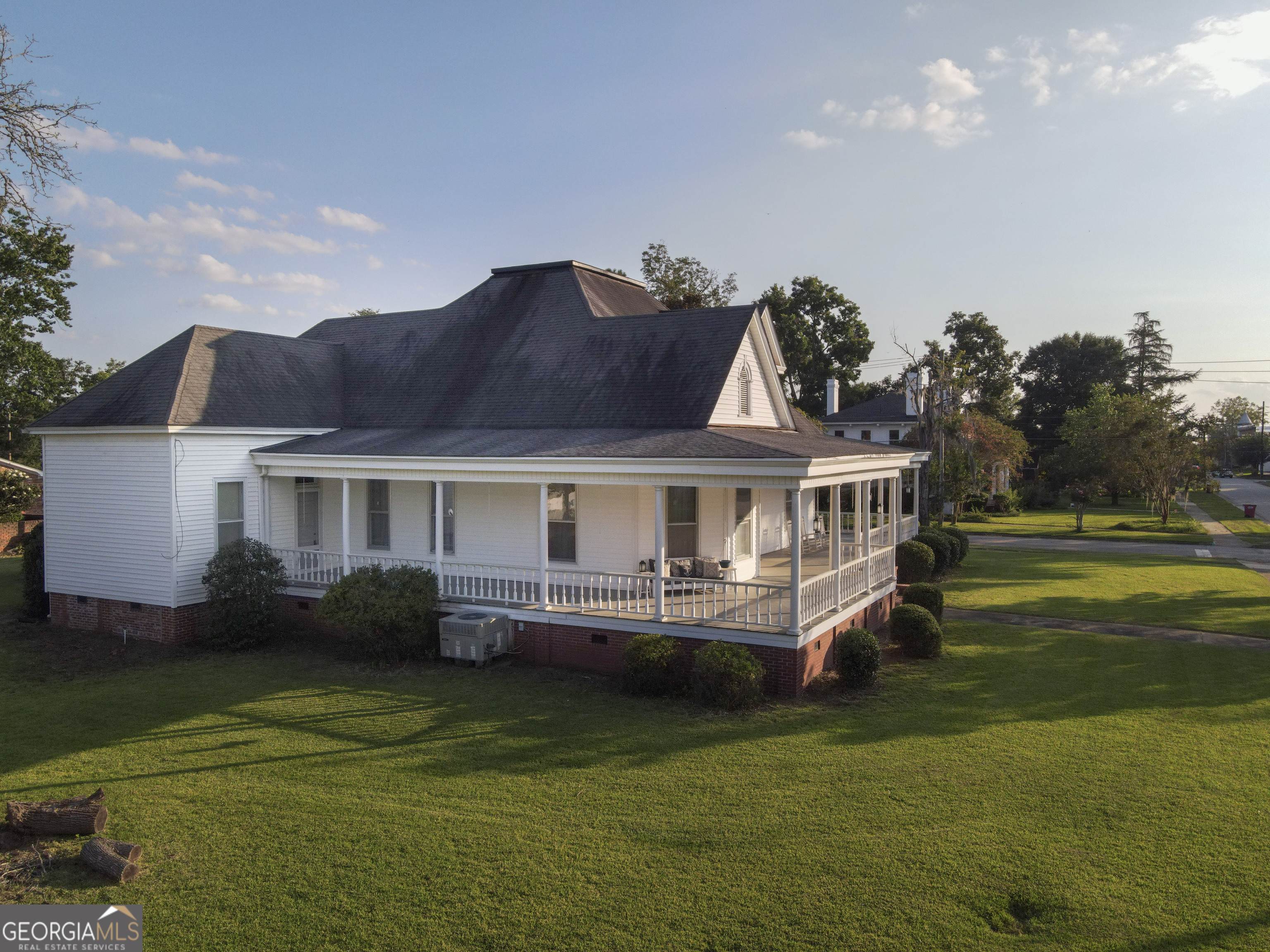 802 Mulberry Street Louisville, GA 30434 - Photo 45 of 51 a front view of a house with a garden and lake view