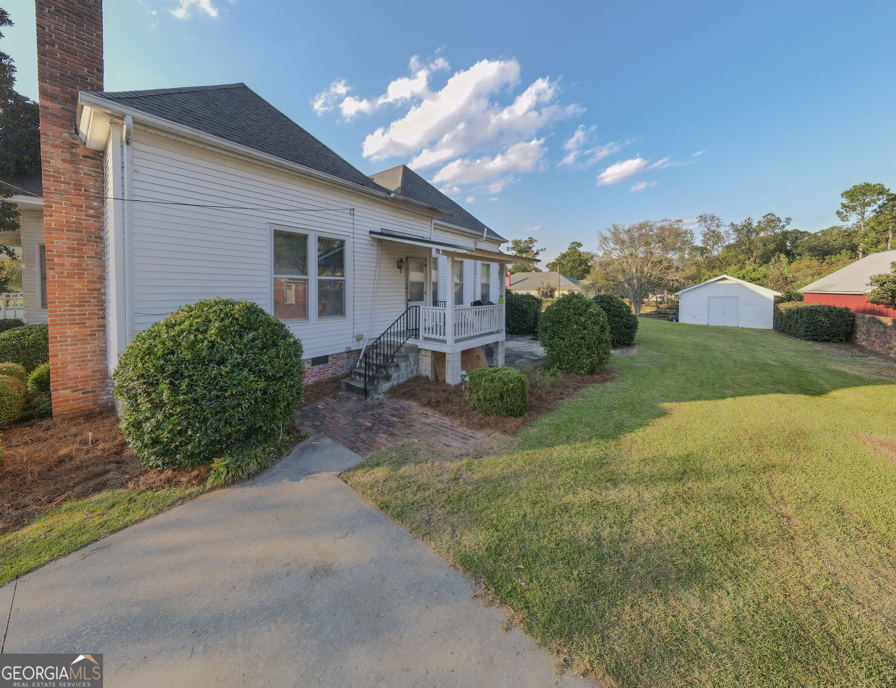 802 Mulberry Street Louisville, GA 30434 - Photo 49 of 51 a house view with a garden space