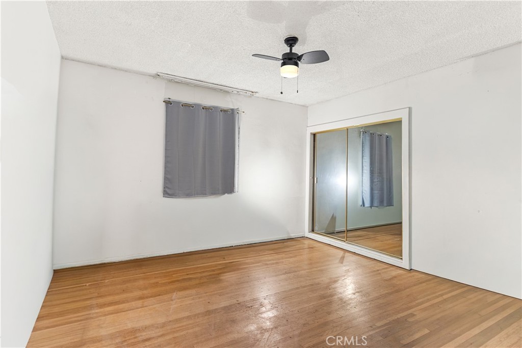 620 South Barclay Avenue Compton, CA 90220 - Photo 5 of 9 a view of an empty room and wooden floor