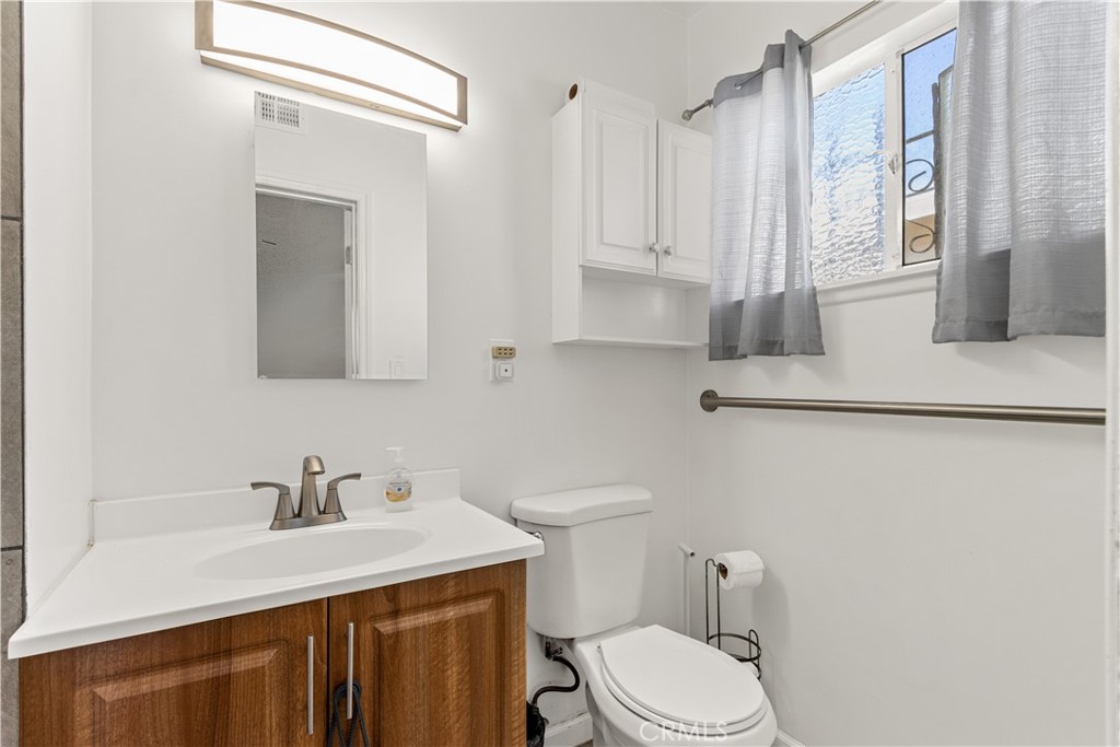 620 South Barclay Avenue Compton, CA 90220 - Photo 6 of 9 a bathroom with a sink vanity granite and toilet