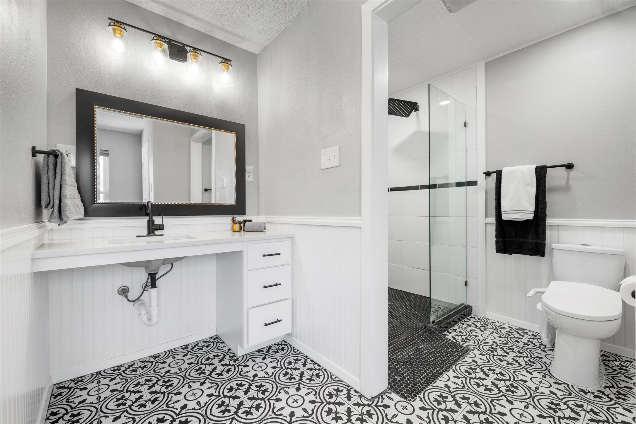 11302 Windermere Meadows Austin, TX 78759 - Photo 13 of 26 a bathroom with a sink toilet and shower