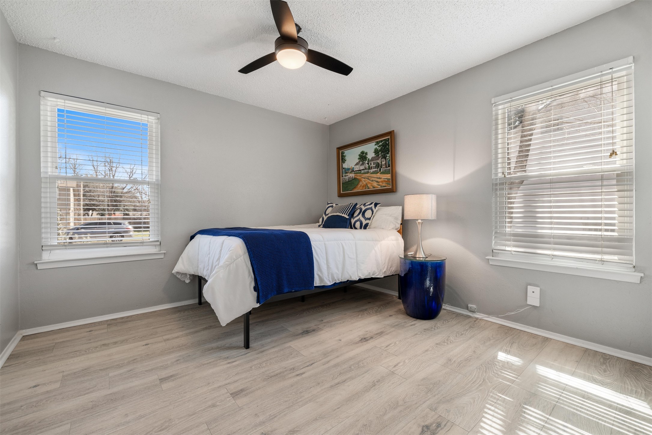 11302 Windermere Meadows Austin, TX 78759 - Photo 15 of 26 a bed room with a bed and a window
