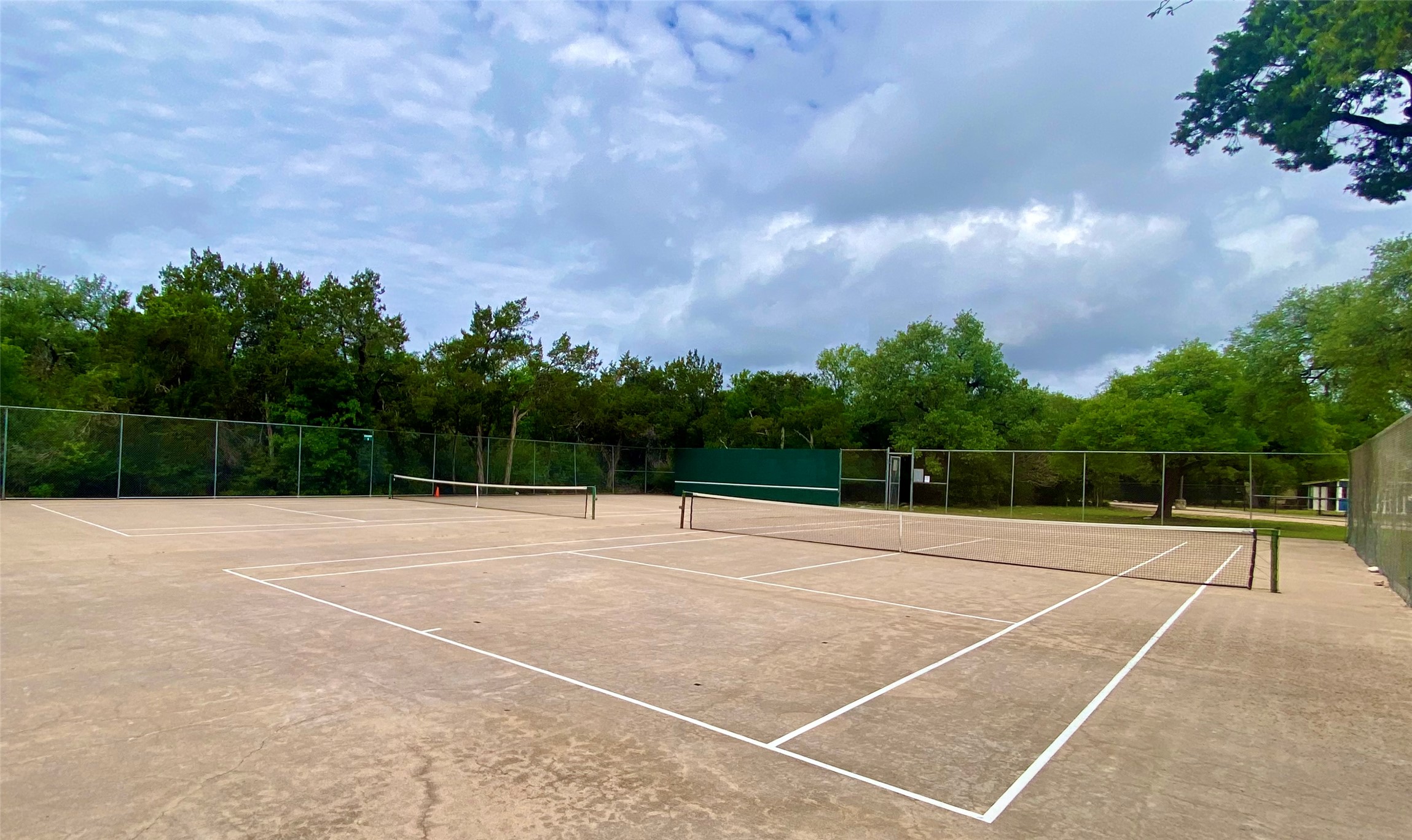 11302 Windermere Meadows Austin, TX 78759 - Photo 24 of 26 a view of an outdoor space and tennis court
