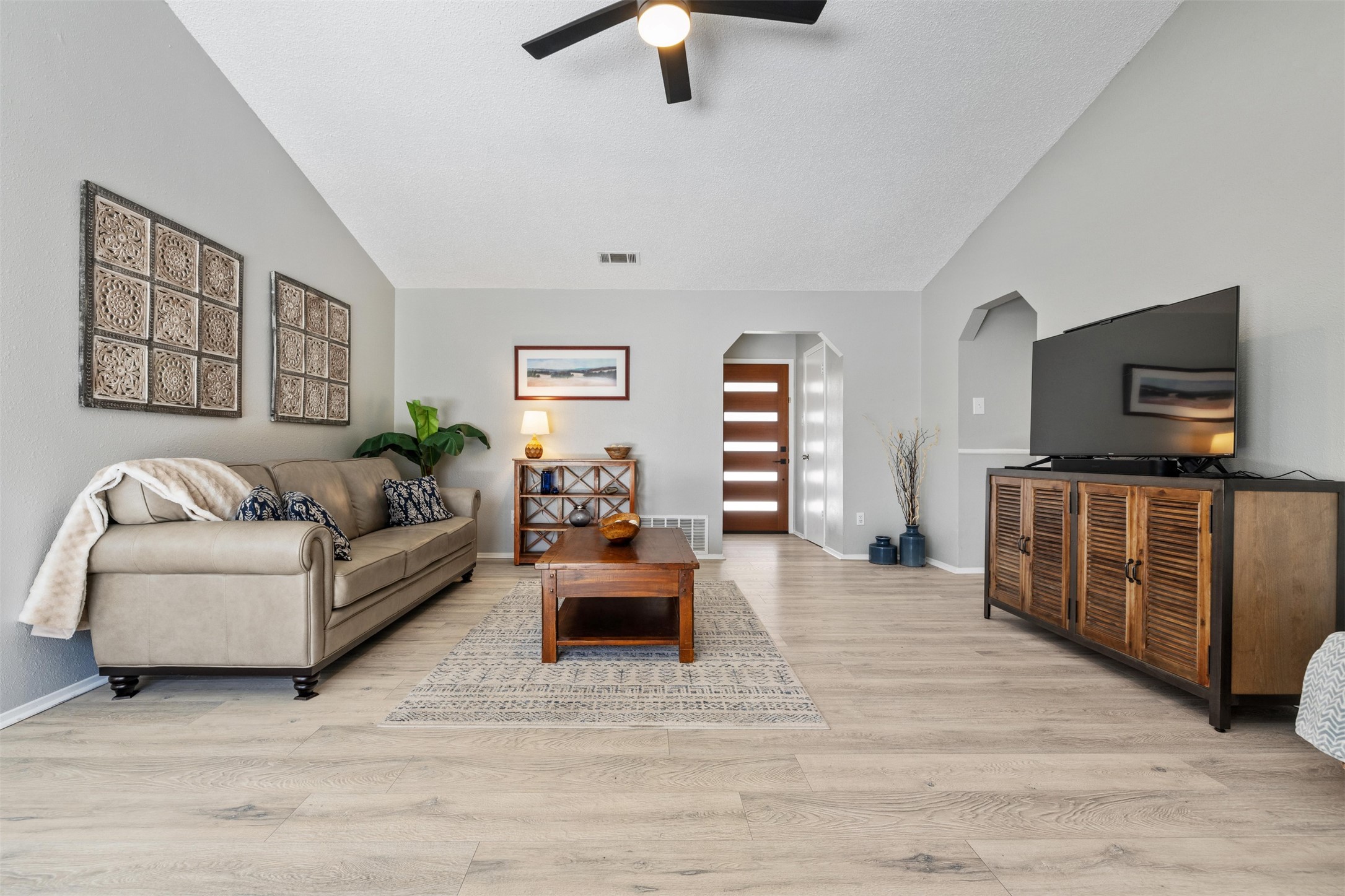 11302 Windermere Meadows Austin, TX 78759 - Photo 7 of 26 a living room with furniture and a flat screen tv