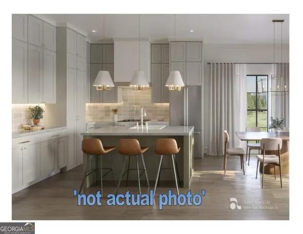 a kitchen with a dining table chairs and white cabinets