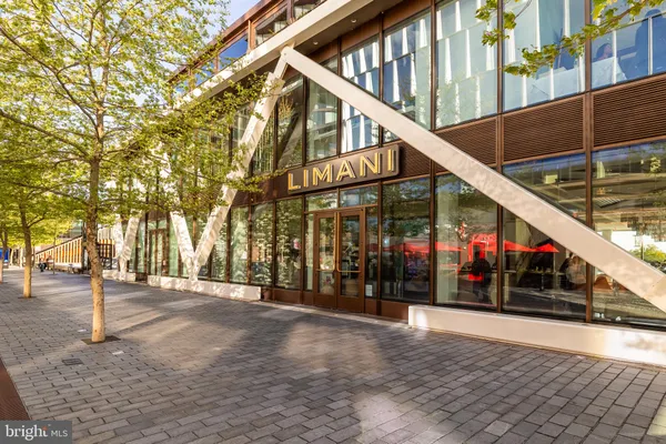 a view of a lake with houses in the back