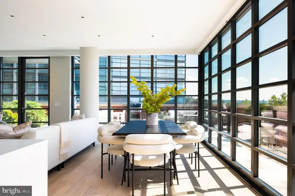 a view of a dining room with furniture window and wooden floor