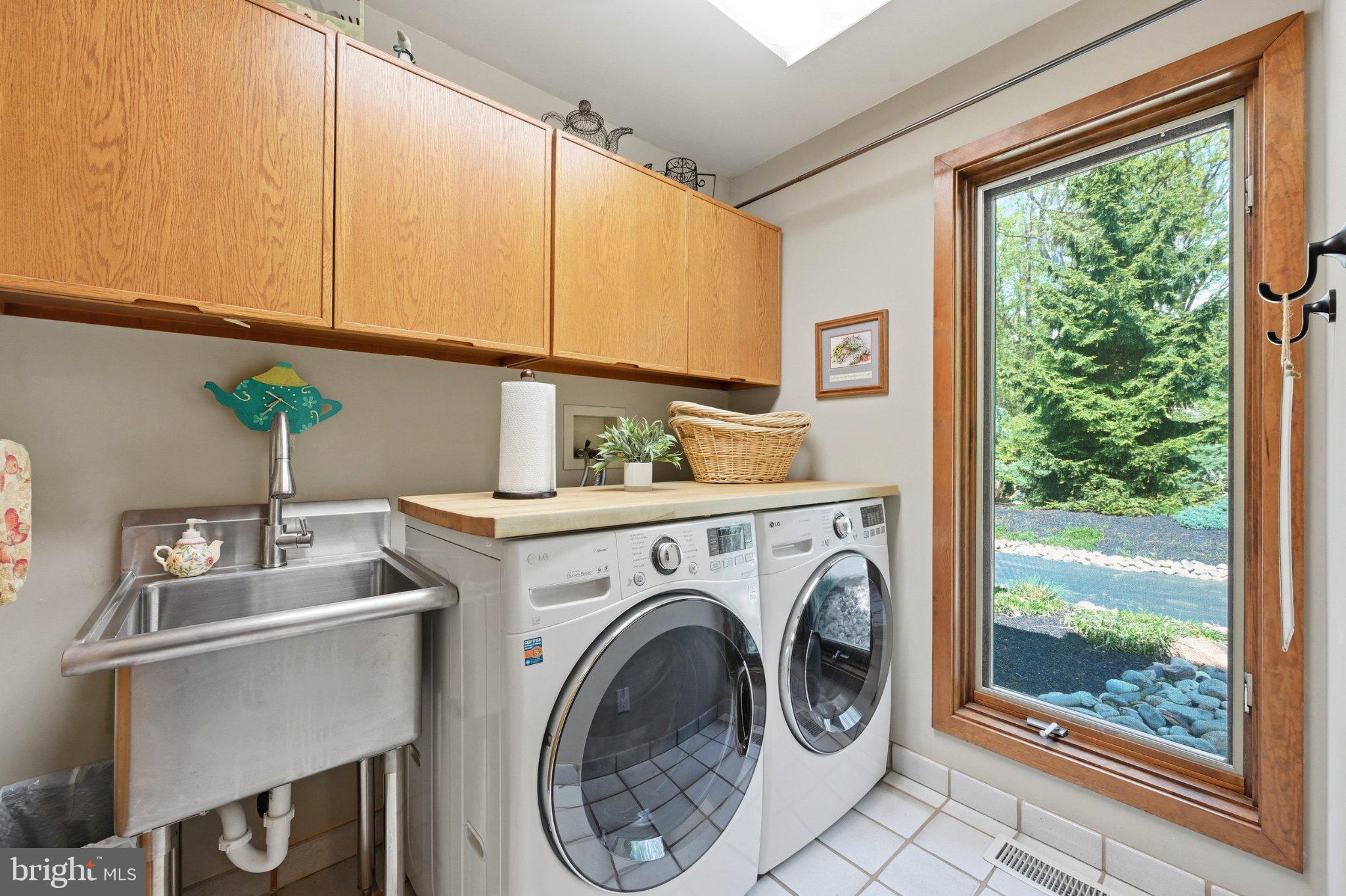 1168 Skelp Level Road Downingtown, PA 19335 - Photo 21 of 80 Bright laundry room with garden view.