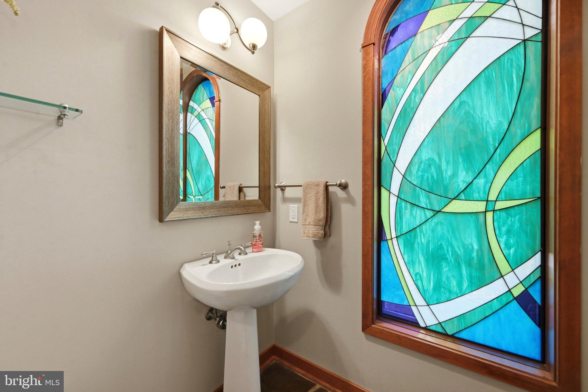 1168 Skelp Level Road Downingtown, PA 19335 - Photo 5 of 80 Vibrant stained glass enhances elegance.
