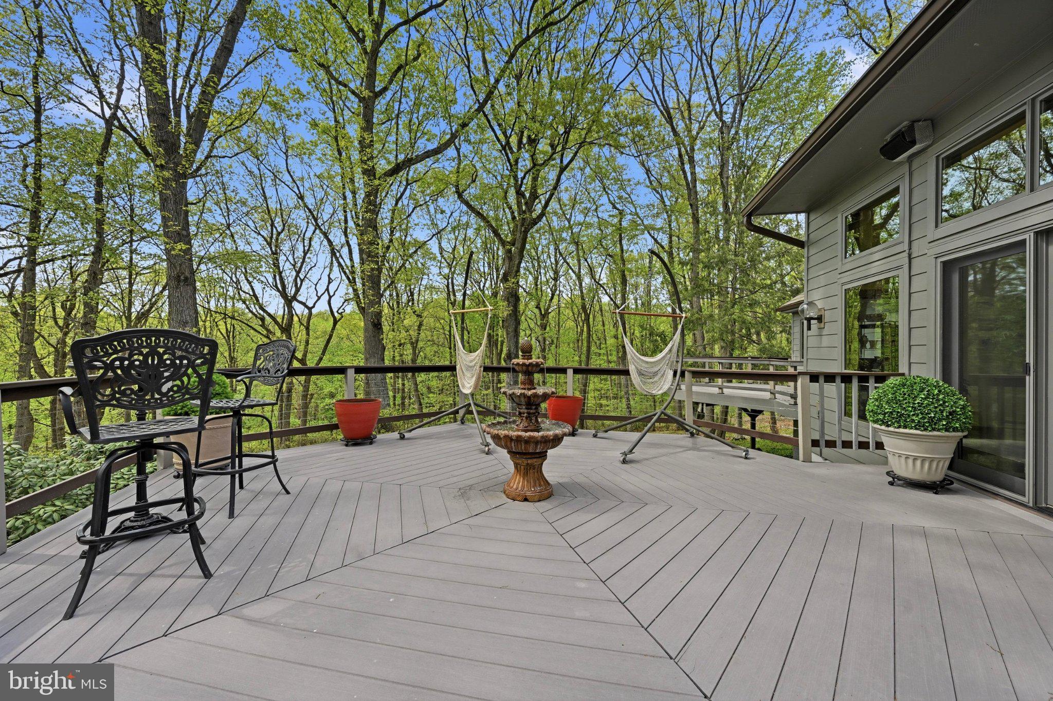 1168 Skelp Level Road Downingtown, PA 19335 - Photo 70 of 80 Serene deck nestled in lush greenery.