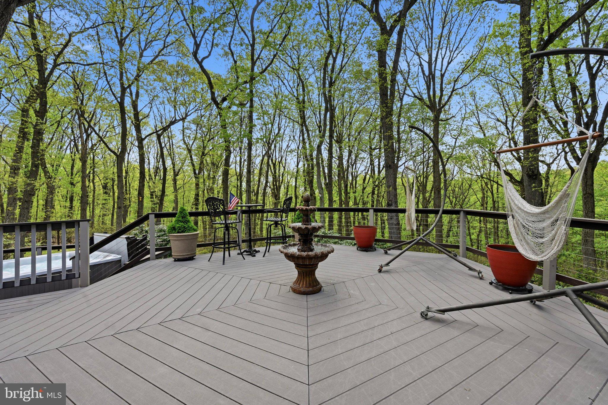 1168 Skelp Level Road Downingtown, PA 19335 - Photo 72 of 80 Serene deck nestled in lush greenery.