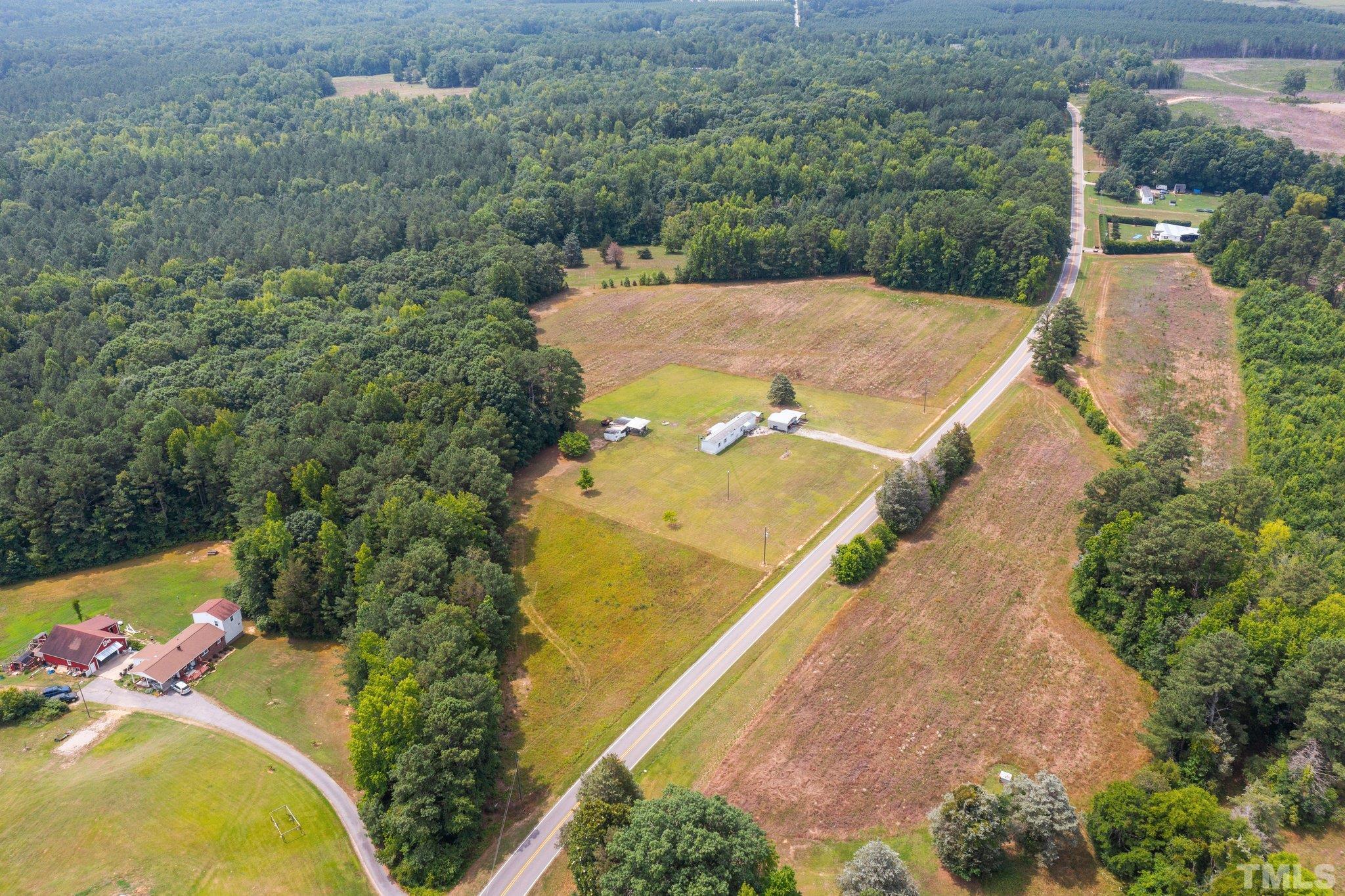 672 Green Hill Road Franklinton, NC 27525 - Photo 1 of 16 an aerial view of a house having yard
