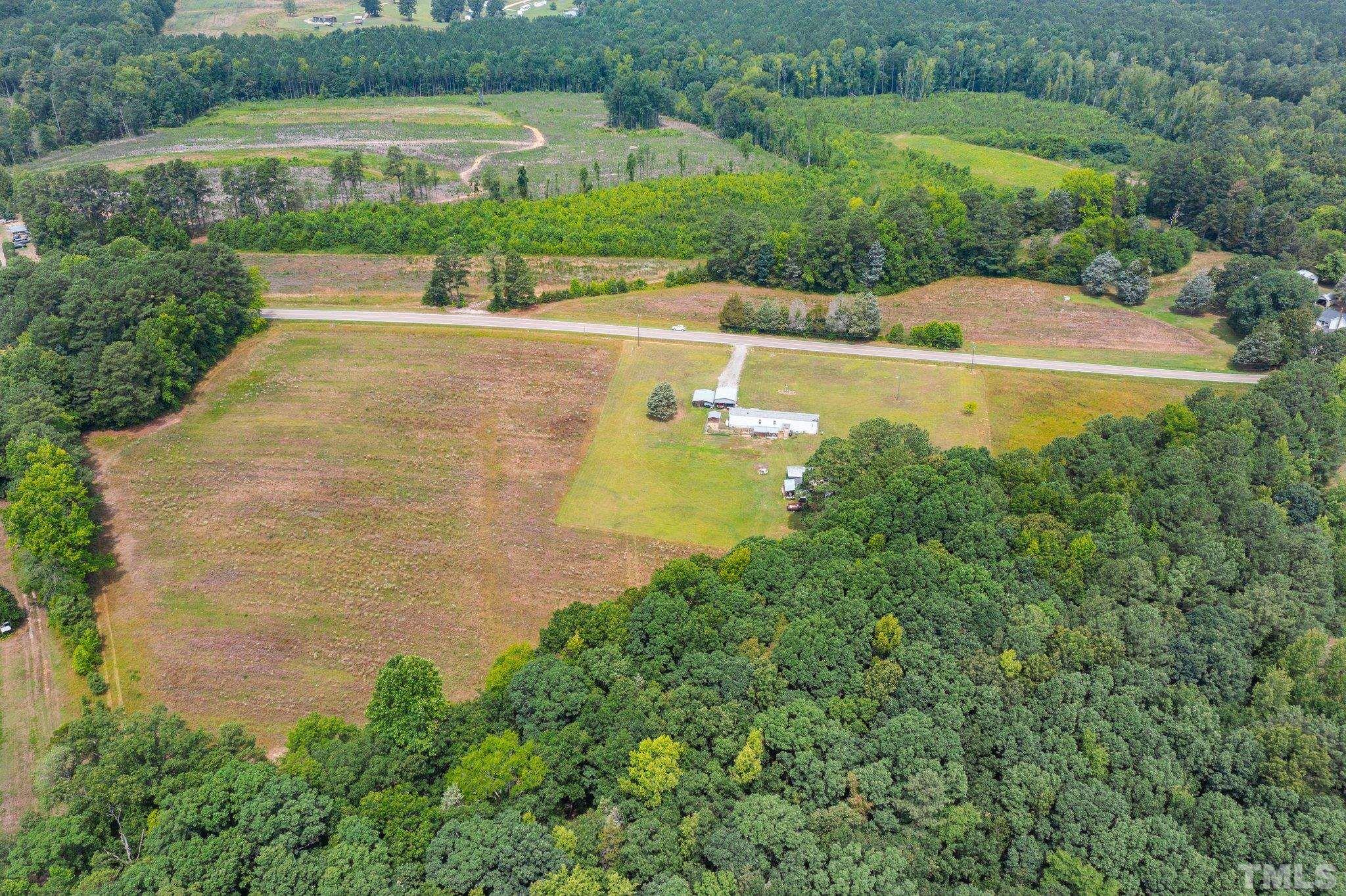 672 Green Hill Road Franklinton, NC 27525 - Photo 11 of 16 an aerial view of residential houses with outdoor space and trees