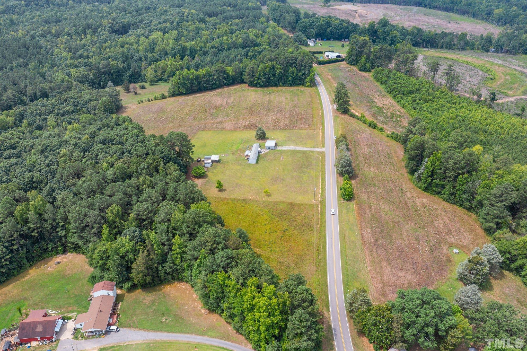 672 Green Hill Road Franklinton, NC 27525 - Photo 13 of 16 an aerial view of a house with a yard and lake view