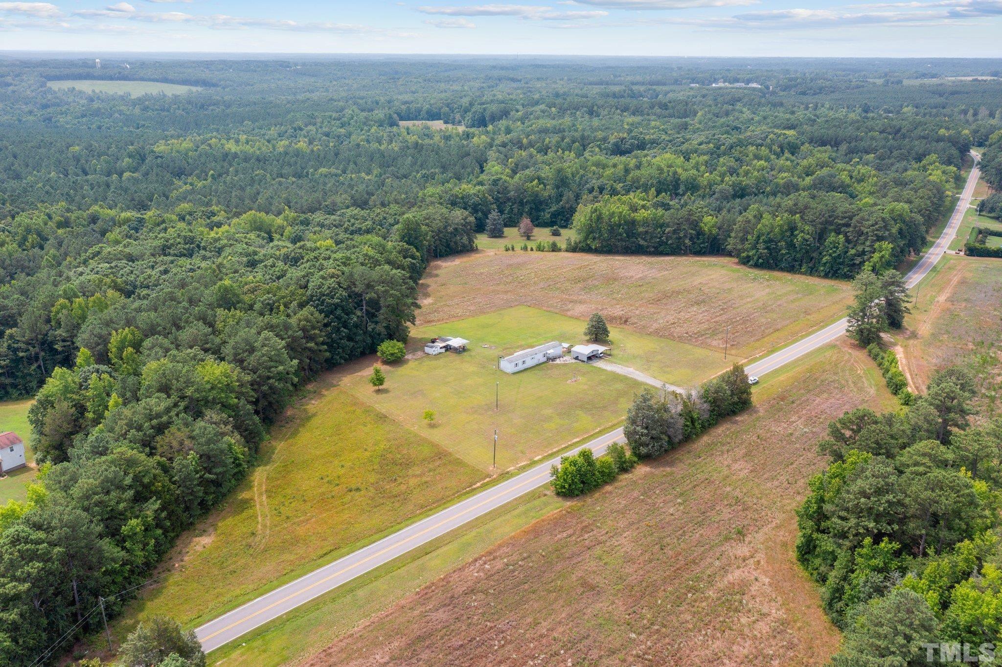 672 Green Hill Road Franklinton, NC 27525 - Photo 15 of 16 a view of a field with an ocean