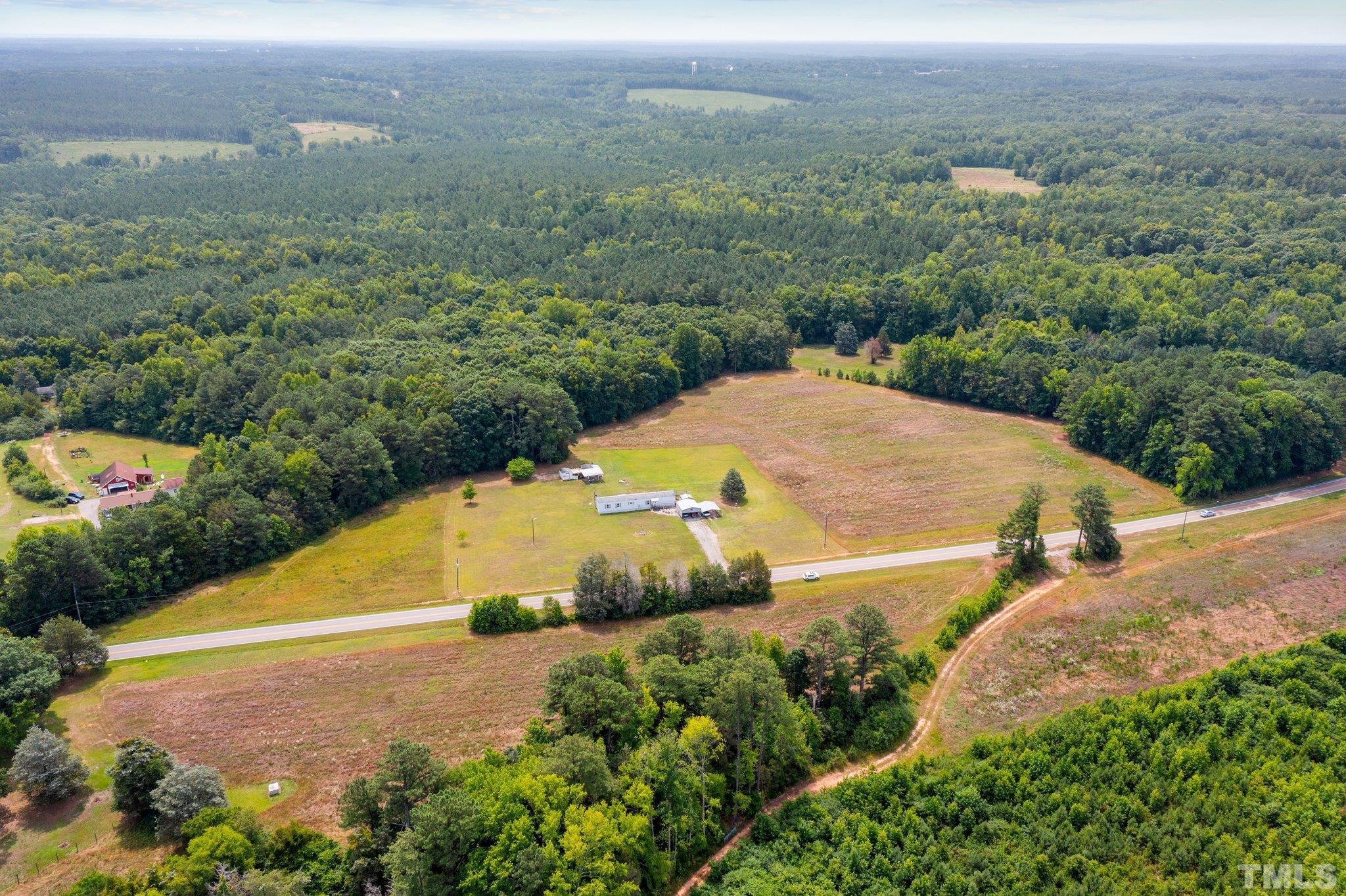 672 Green Hill Road Franklinton, NC 27525 - Photo 3 of 16 an aerial view of residential houses with outdoor space and trees