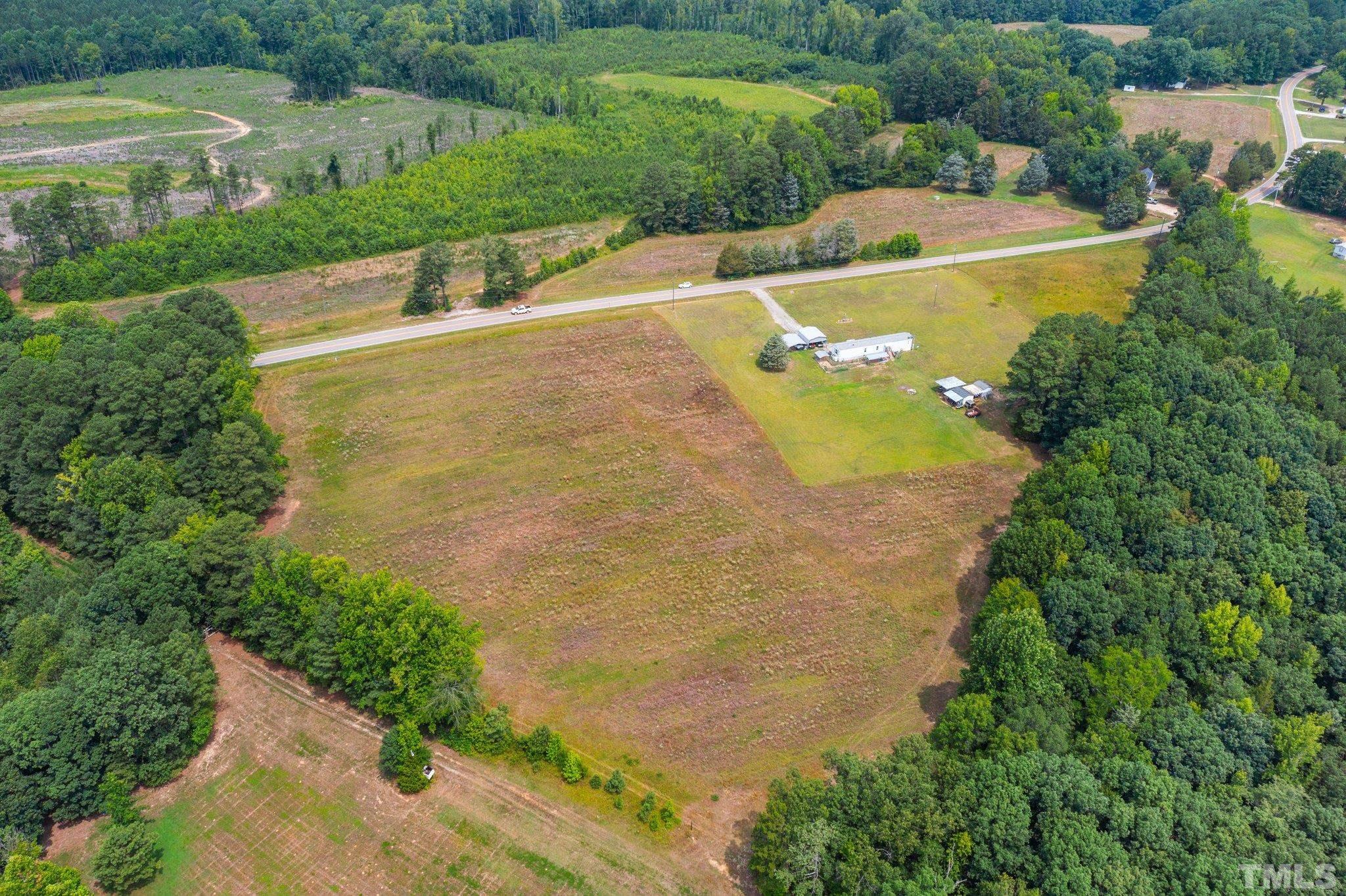 672 Green Hill Road Franklinton, NC 27525 - Photo 9 of 16 an aerial view of a house with a garden and swimming pool