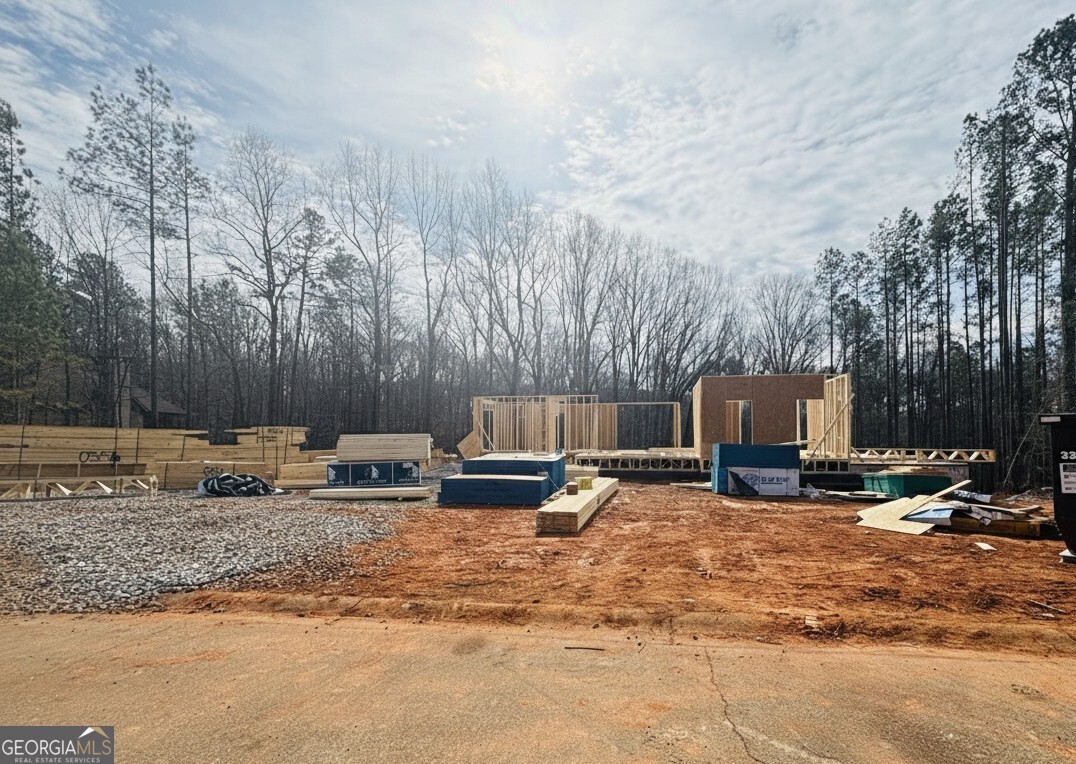 2037 Boulder Ridge Lane Bishop, GA 30621 - Photo 7 of 10 a view of a backyard with furniture and a fire pit