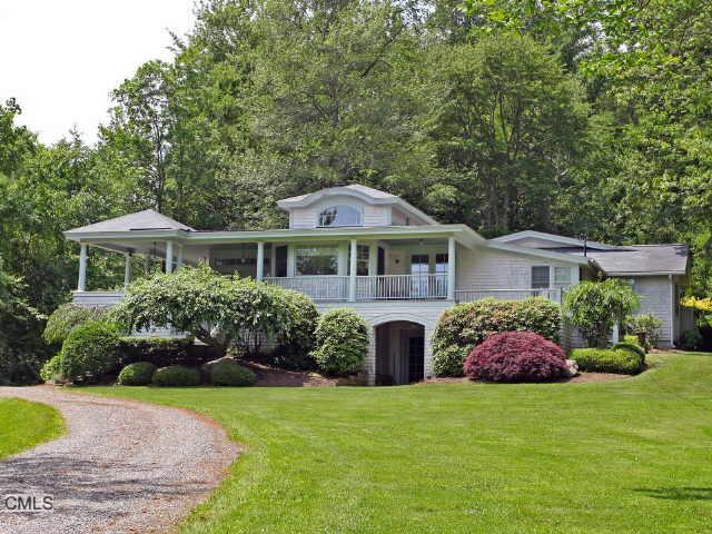 327 West Shore Road Washington, CT 06777 - Photo 1 of 1 a front view of house with yard and green space