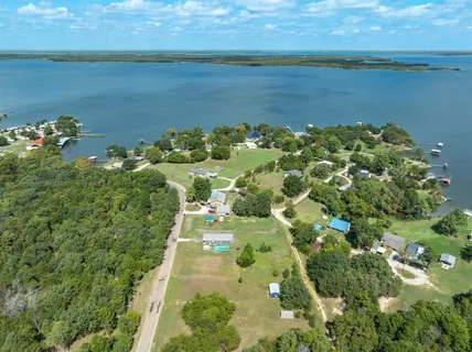 a view of a lake with a yard