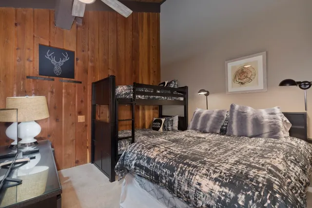 a bedroom with a bed and a night stand