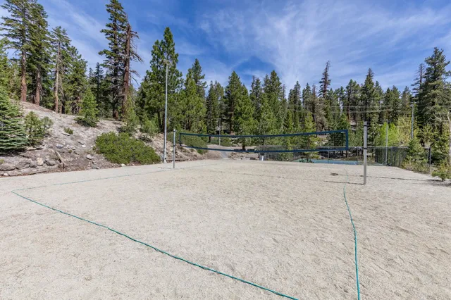 a view of a playground with basketball court