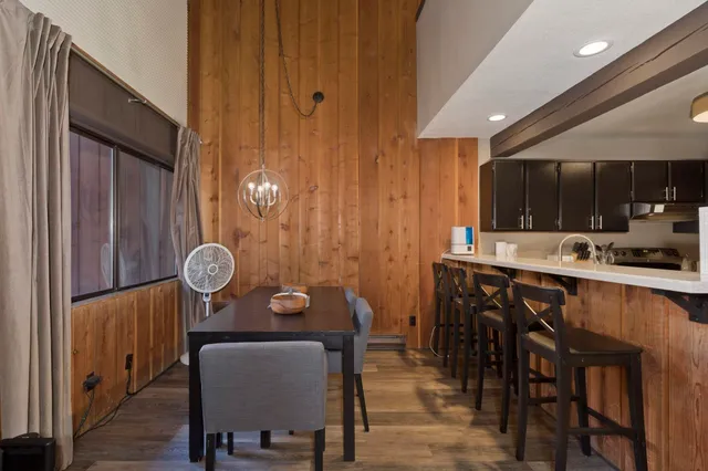 an open kitchen with a table and chairs