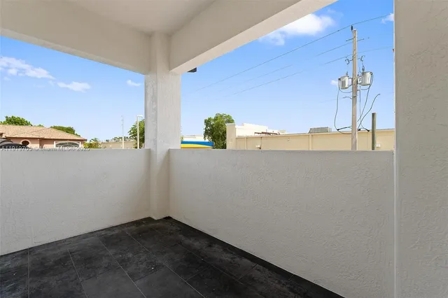 a view of a street with a building in the background